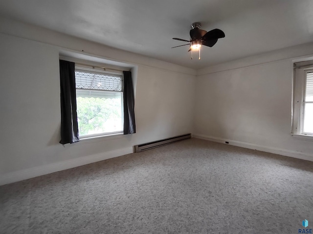 empty room with ceiling fan and a baseboard radiator