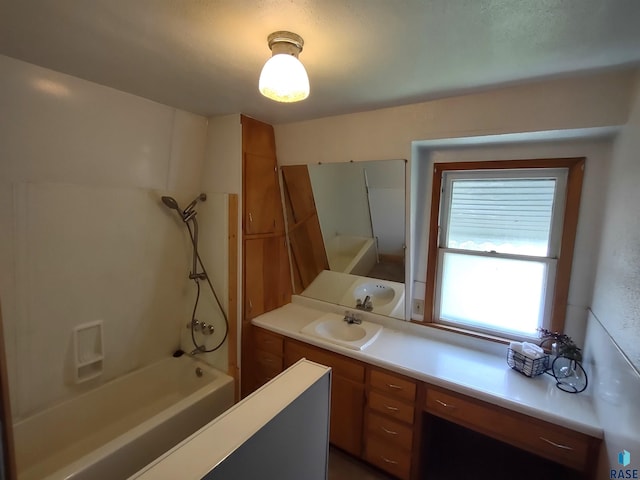 bathroom with vanity and washtub / shower combination