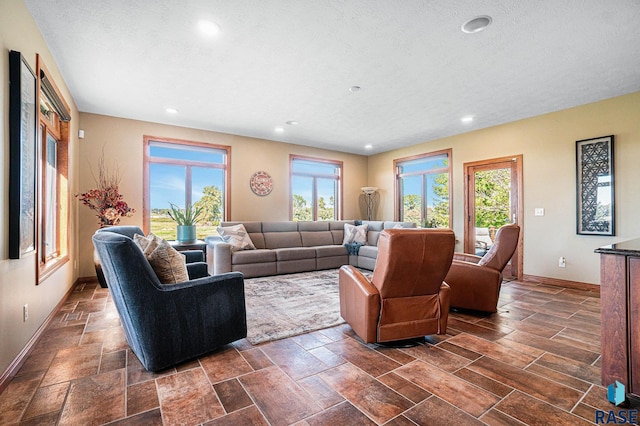 living room featuring a textured ceiling