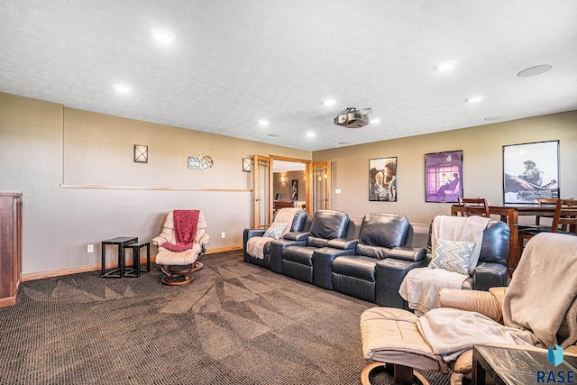 cinema featuring a textured ceiling and carpet