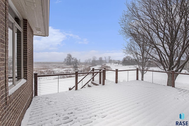 view of snow covered deck