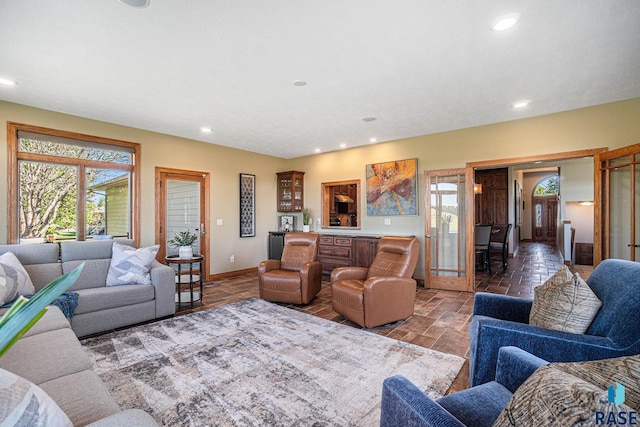 living room featuring french doors and a wealth of natural light