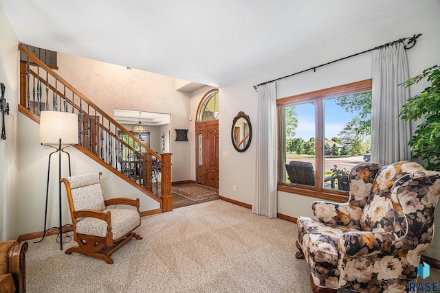 sitting room featuring light colored carpet