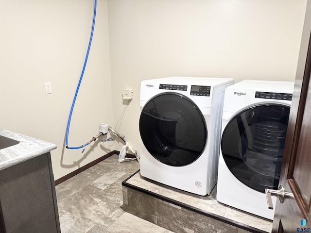 laundry area with independent washer and dryer