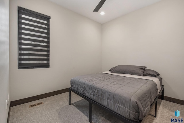 bedroom with ceiling fan and carpet