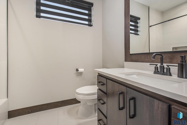 bathroom with vanity, toilet, tile patterned flooring, and a shower