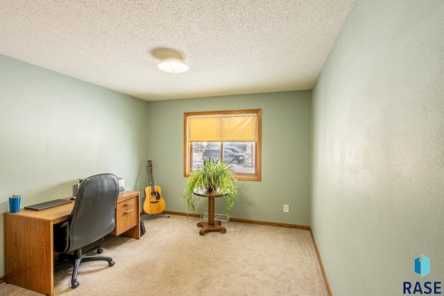 office with light carpet and a textured ceiling