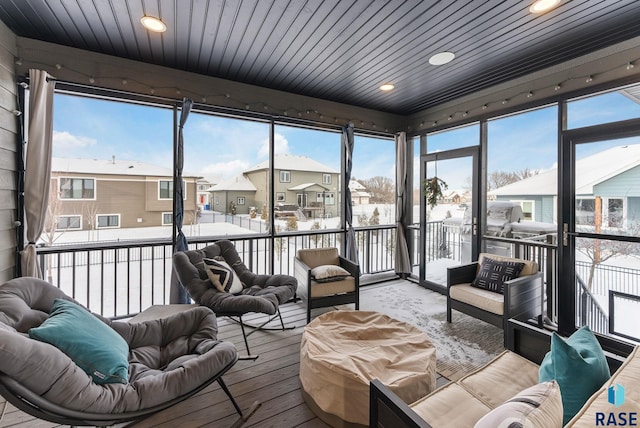 sunroom featuring wood ceiling