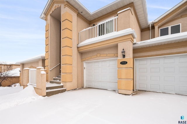 view of front of house with a balcony and a garage