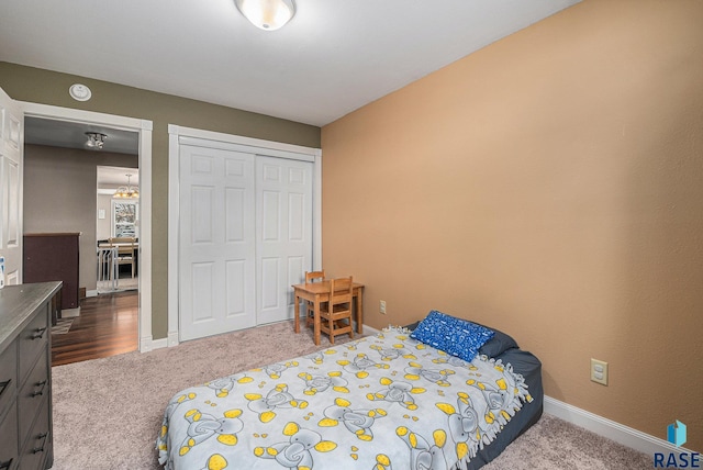 carpeted bedroom with a closet