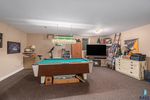 game room with billiards, a textured ceiling, and dark colored carpet