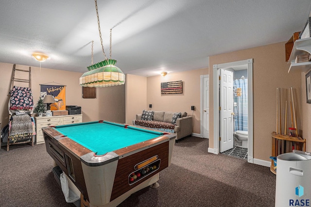 game room with billiards, a textured ceiling, and dark colored carpet