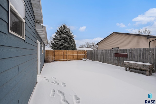 view of yard layered in snow