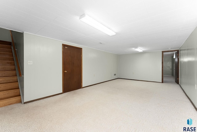 basement with light colored carpet