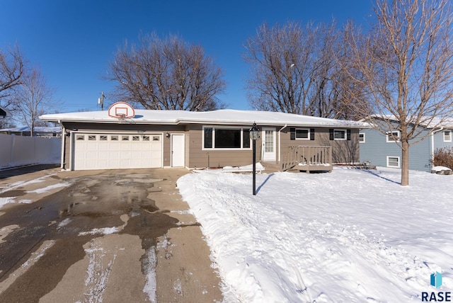 single story home with a garage and driveway