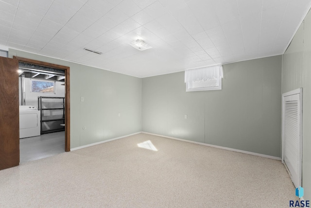 interior space featuring washer / clothes dryer and light carpet