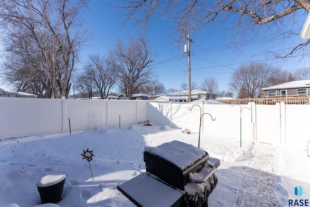 view of yard layered in snow