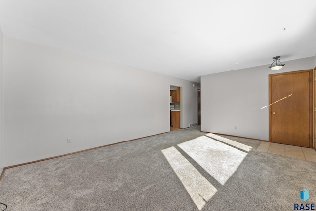 unfurnished living room with light carpet