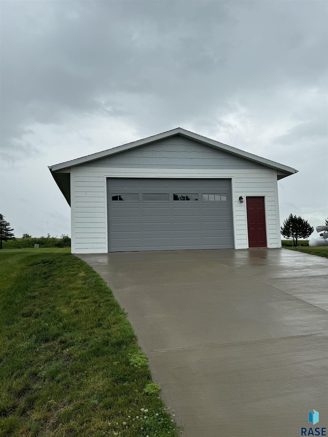 garage featuring a yard