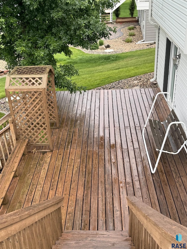 deck featuring a lawn