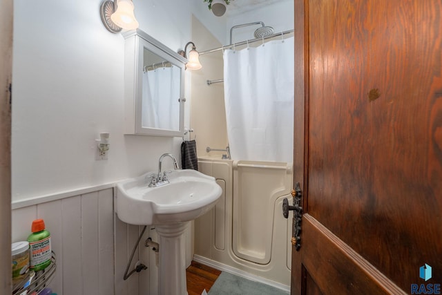 bathroom with sink and shower / bath combination with curtain