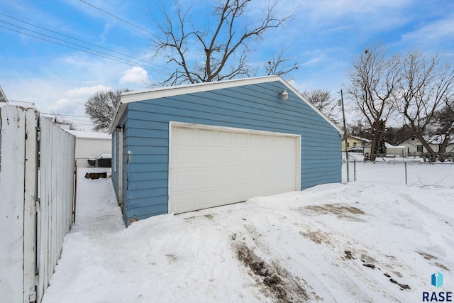 view of snow covered garage