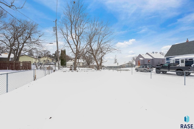 view of yard layered in snow