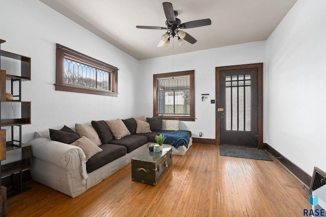 living room with hardwood / wood-style flooring and ceiling fan