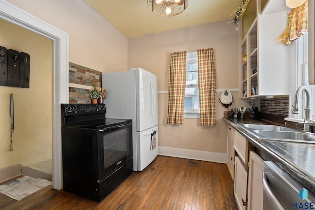 kitchen featuring white cabinetry, stainless steel dishwasher, black range with electric stovetop, and sink