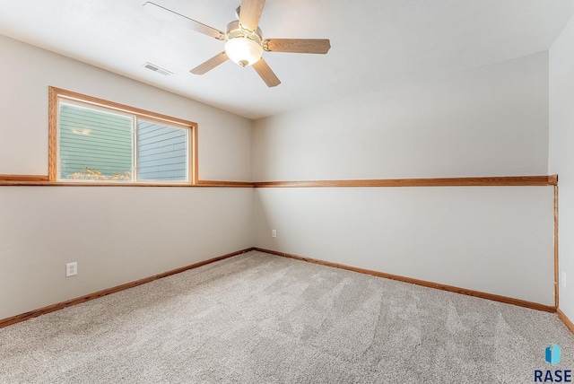 empty room featuring carpet floors and ceiling fan