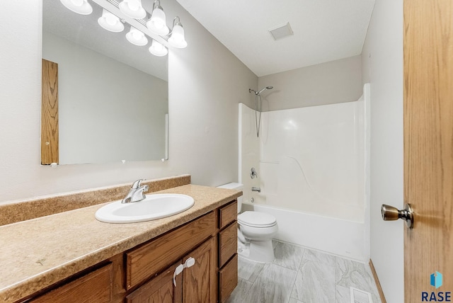 full bathroom featuring vanity, tub / shower combination, and toilet