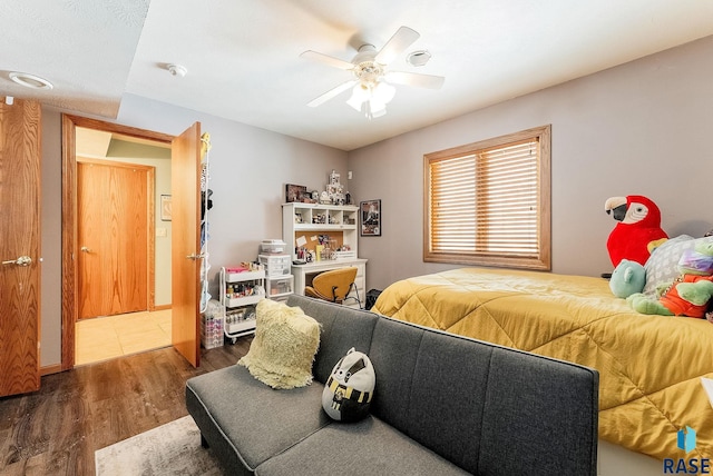 bedroom featuring dark wood-type flooring and ceiling fan