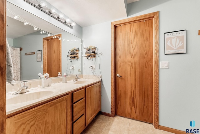 bathroom with vanity and tile patterned floors