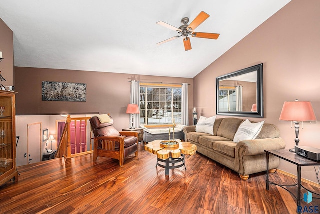 living room with hardwood / wood-style flooring, ceiling fan, and lofted ceiling