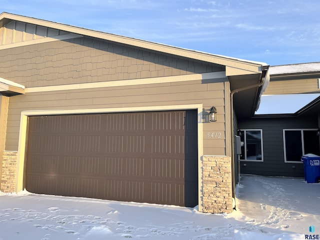 view of snow covered garage