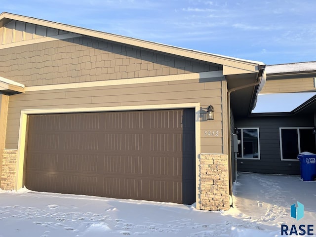 view of snow covered garage