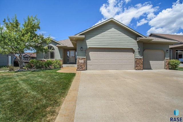 view of front facade with a garage and a front yard