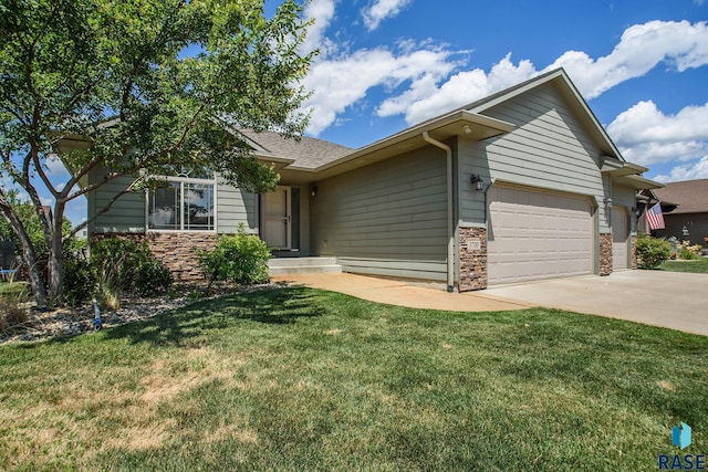 ranch-style house with a garage and a front lawn