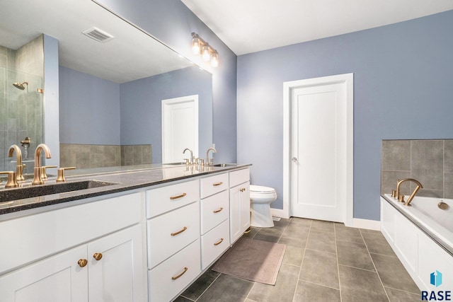 bathroom with a tub, tile patterned flooring, toilet, and vanity