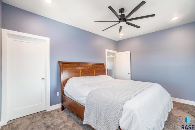 carpeted bedroom with ceiling fan