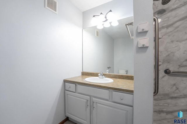 bathroom with toilet and vanity