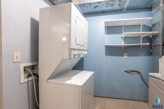 laundry area featuring stacked washer and dryer