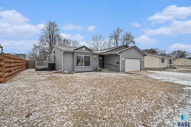 ranch-style house featuring a garage