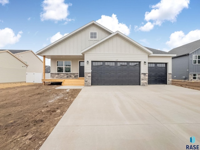 view of front of property featuring a garage and a porch