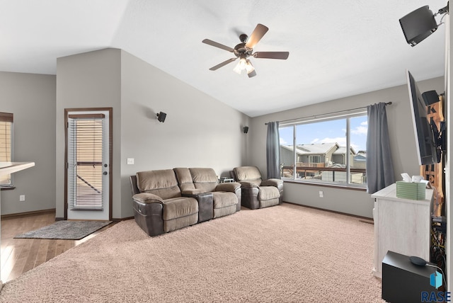 living room with lofted ceiling, ceiling fan, and wood-type flooring