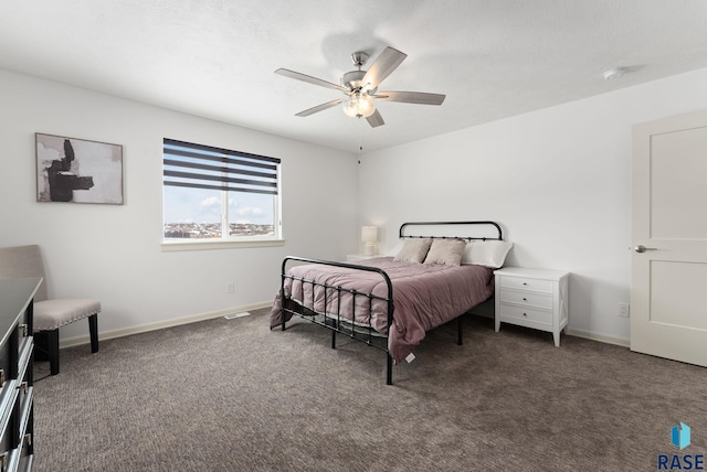 bedroom featuring dark carpet and ceiling fan