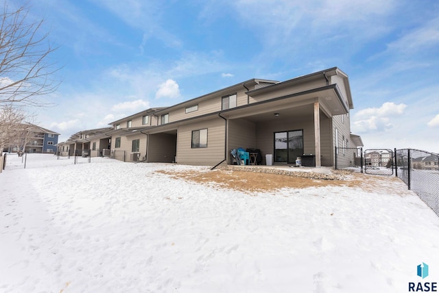 view of snow covered house