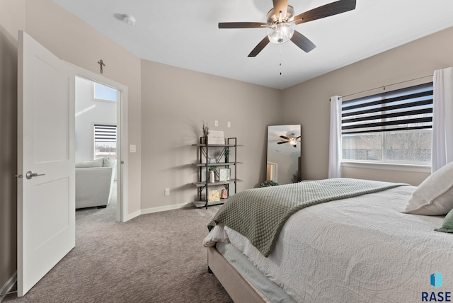 carpeted bedroom featuring ceiling fan