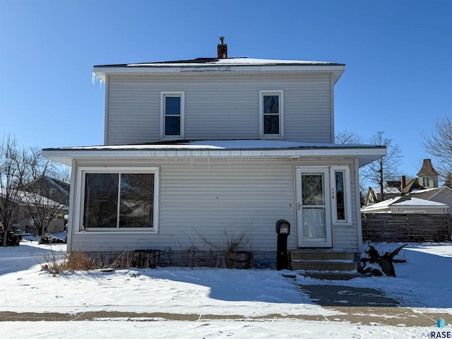 view of snow covered property