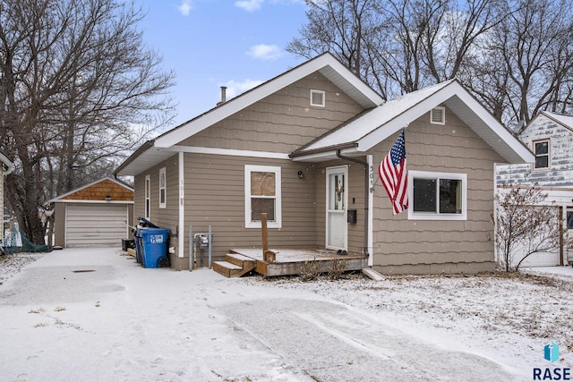 bungalow-style home with an outbuilding and a garage